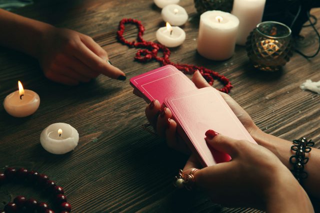 Witch fortune teller reading fortune close up