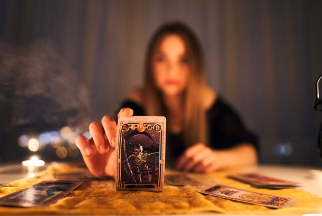 fake psychic with tarot
